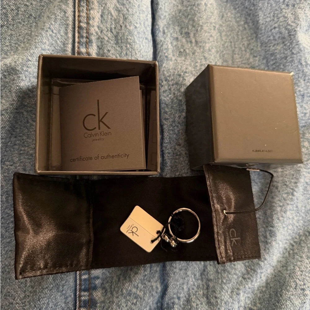 Calvin Klein Ring-Spinner/Fidget/Paw Print Stainless Steel w/Dust Bag NWT NIB - Picture 1 of 5